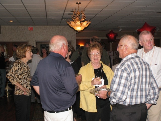 Jane Williams and husband Don (to her left) talking with George Herrick & Randy Hopf